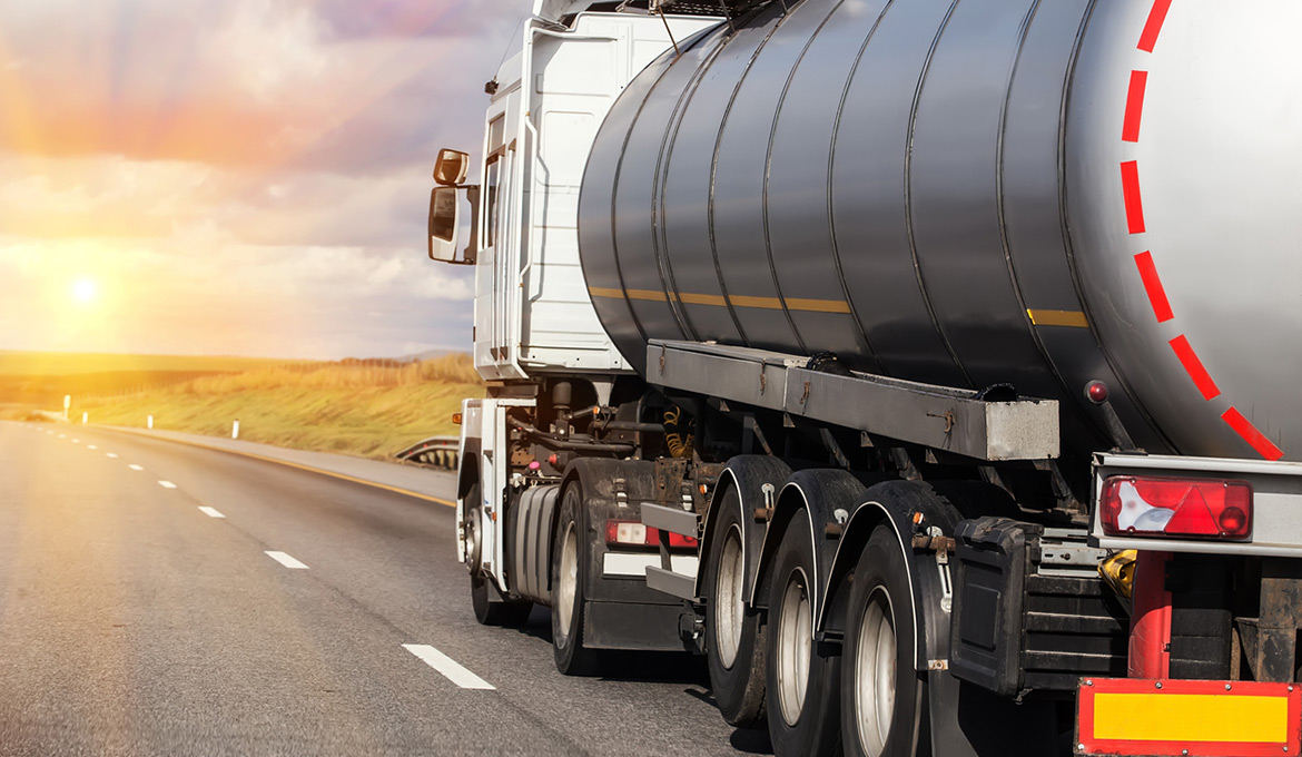 Tanker truck with fuel driving along the interstate.