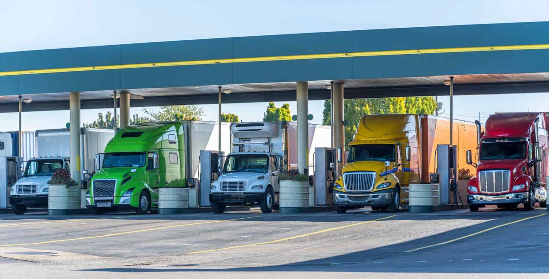 A large fleet fueling up at a station.