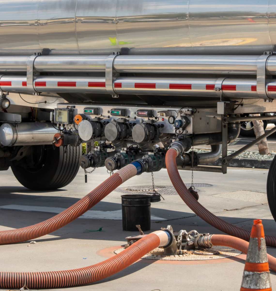 Tanker truck delivery fuel to underground storage tanks.