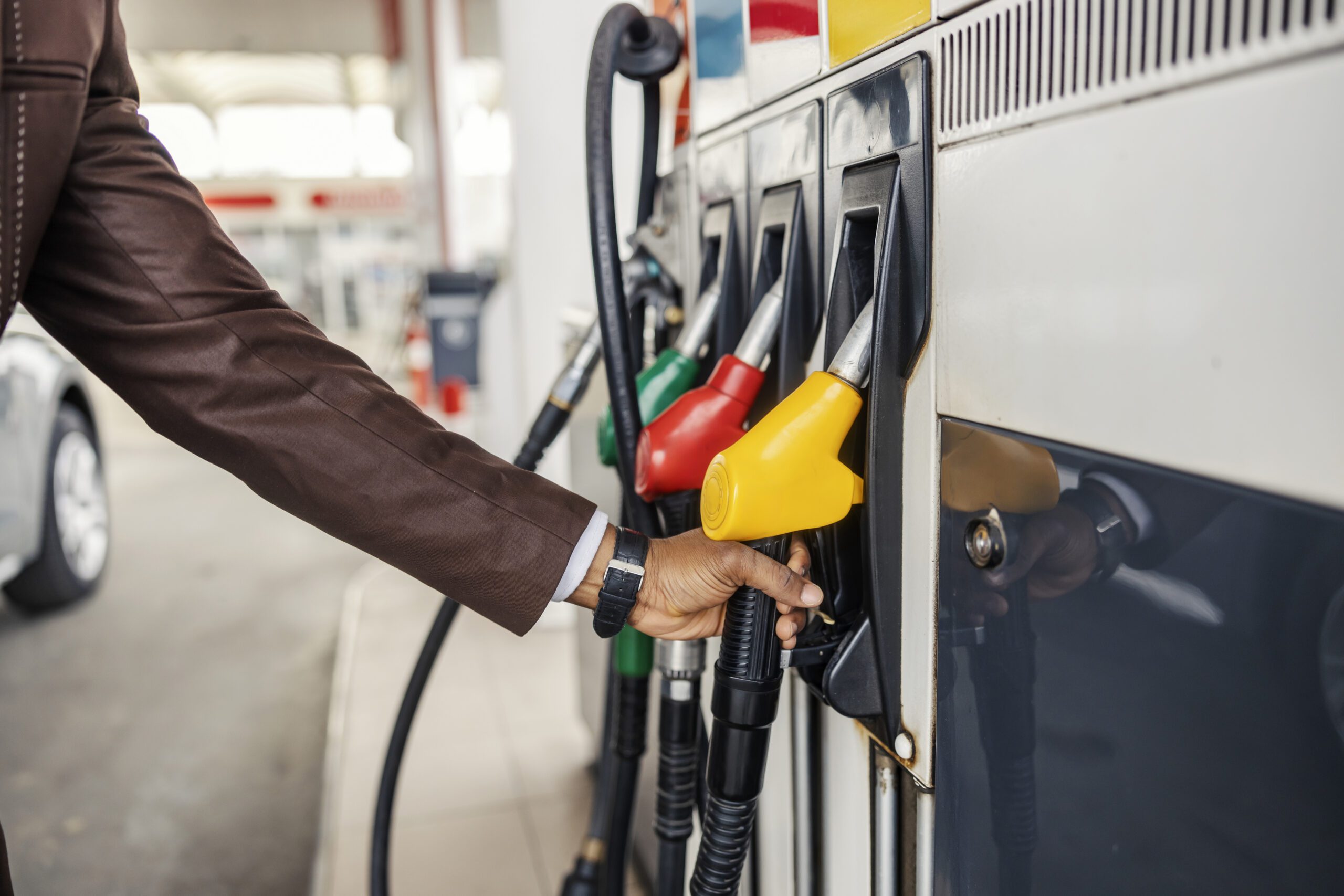Fuel dispenser nozzles at a service station